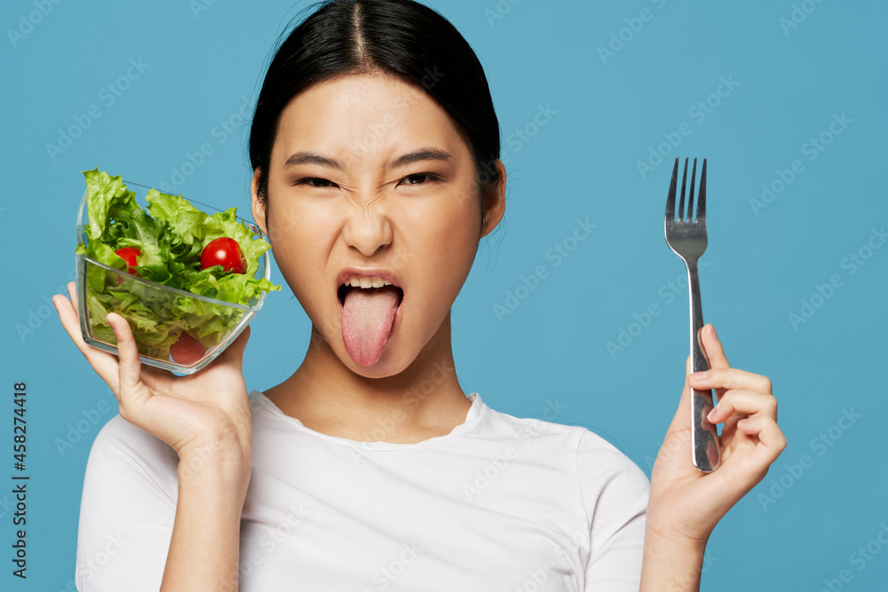 women grimaced disgust diet calorie salad plate