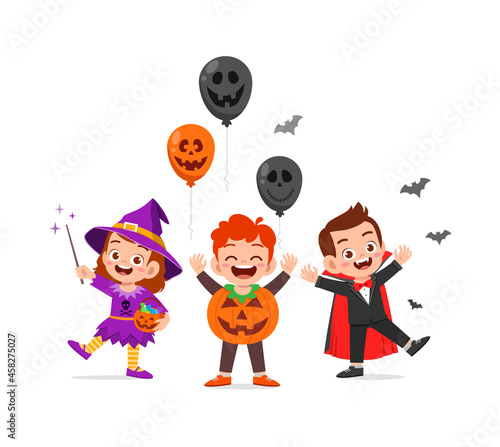 cute little boy and girl celebrate halloween with friend