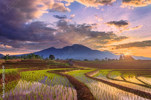 the atmosphere of the morning sunrise over the terraces of rice fields and high mountains