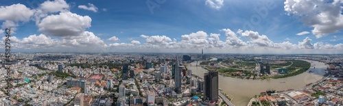 Panoramic photo of Ho Chi Minh city and Saigon river in the cloudy day © Quang