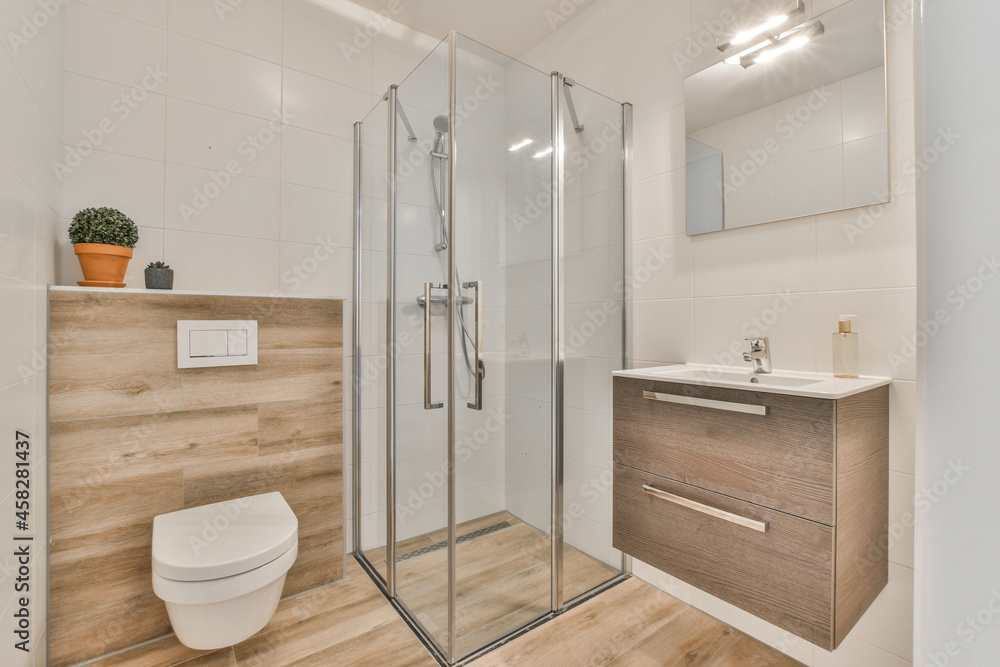 Interior of bathroom with glass shower cabin Interior of bathroom with glass shower cabin