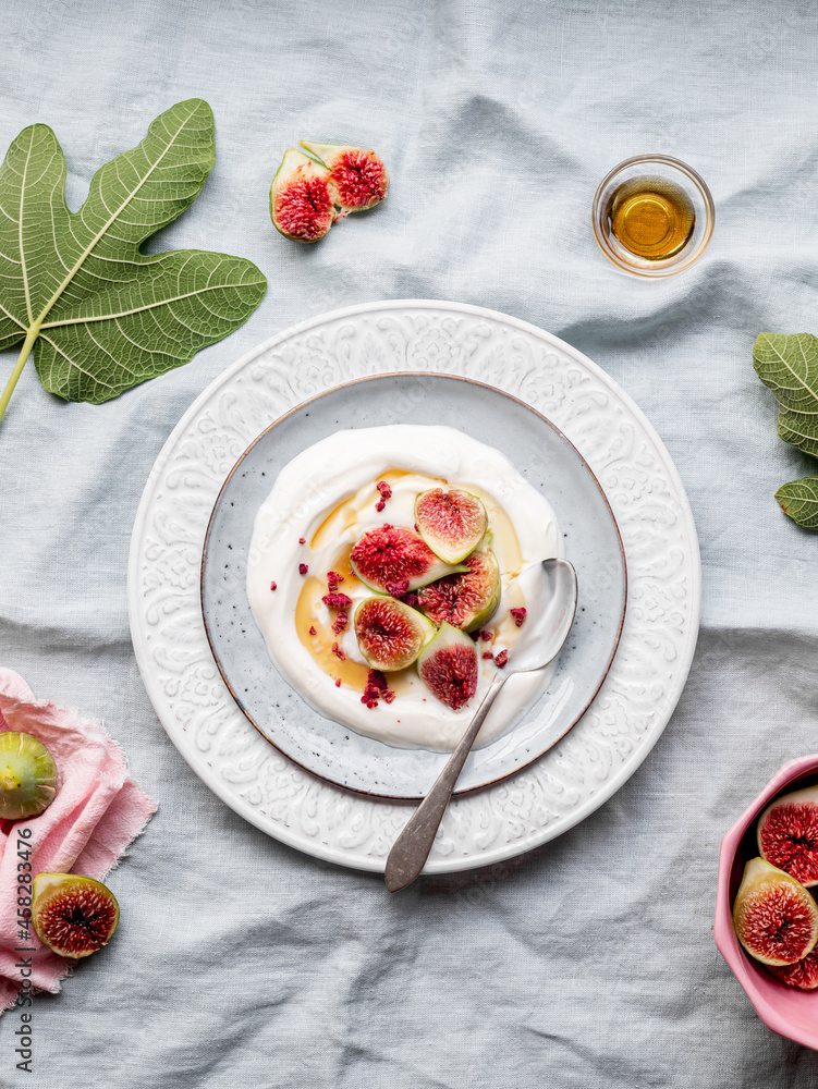 Plate of yogurt with figs viewed from above Plate of yogurt with figs viewed from above