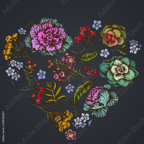 Heart floral design on dark background with wax flower, forget me not flower, tansy, ardisia, brassica, decorative cabbage