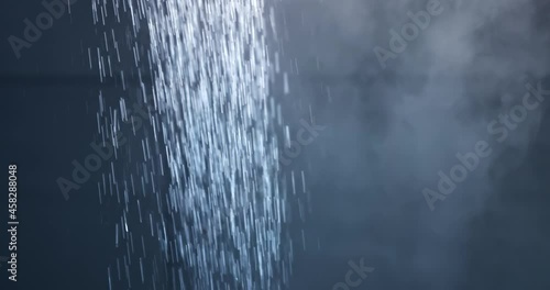 Water pouring from shower letting off steam