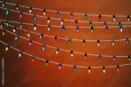 Glowing Lights Garland. Christmas design with light bulb garland. Warm colored light string