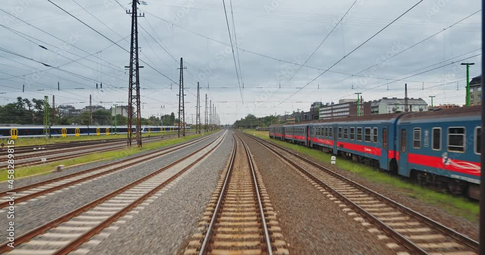 Point of view train travel under cloudy sky Point of view train travel under cloudy sky