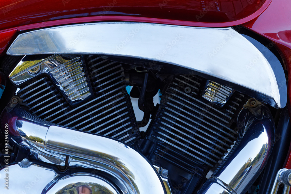 Closeup detail photo chrome engine and exhaust pipe of the motorcycle