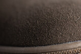 Fragment of brown fashionable beautiful men's autumn boot made of natural suede.