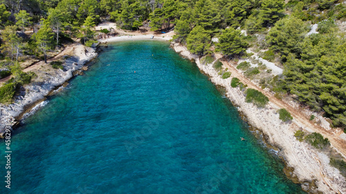 View of the sea coast and beach Kašjun on the island of Šolta. A bay in the adriatic sea. Trees in the hills. Dalmatia. Croatia. Europe