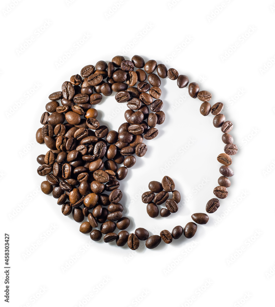 Yin and yang symbol made of coffee beans on white background Yin and yang symbol made of coffee beans on white background