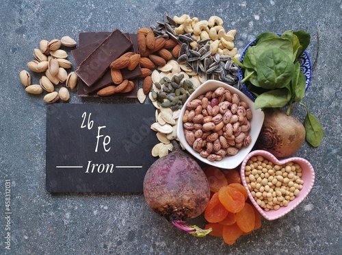 Vegan food rich in iron with symbol Fe and atomic number 26. Natural products containing iron, minerals, vitamins. Healthy sources of iron, healthy eating concept. photo