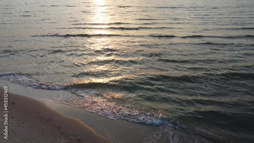 Wallpaper Mural Sunrise on the beach by the sea. Orange sun in a cloudy sky. Holidays on the coast Torontodigital.ca