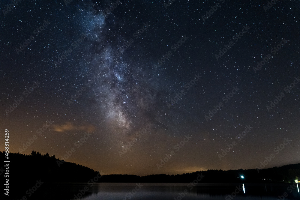 Milky way above Neuvic Lake in Correze, France, Summer 2021