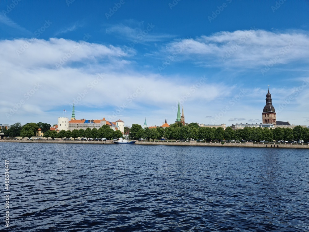 Beautiful panorama from the side of the river to the Latvian capital Riga on a summer day 2021