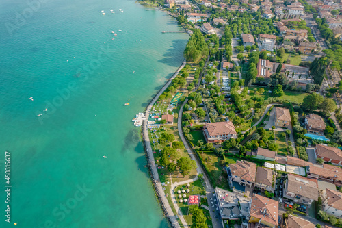 Aerial view of Sirmione resort coastline in Italy on the shore of Garda lake in Lombardy