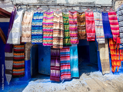 Traditional street market in Chefchaouen with colorful canvas vails style in Morocco - North Africa