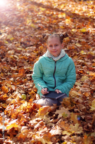Girl in the autumn forest. Golden autumn.