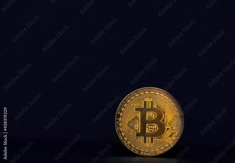 Bitcoin BTC crypto currency gold coins on dark background, new virtual money concept. Mining or blockchain technology Bitcoin BTC crypto currency gold coins on dark background, new virtual money concept. Mining or blockchain technology