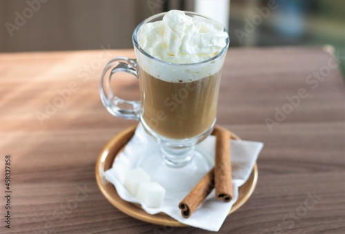 Closeup glass of coffee cappuccino sweet drinks cafe milk breakfast cinnamon caffeine