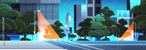 empty night street road with crosswalk city buildings skyline modern architecture cityscape background