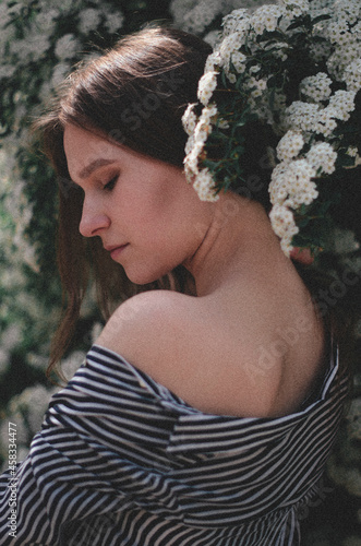 girl near a flowering bush