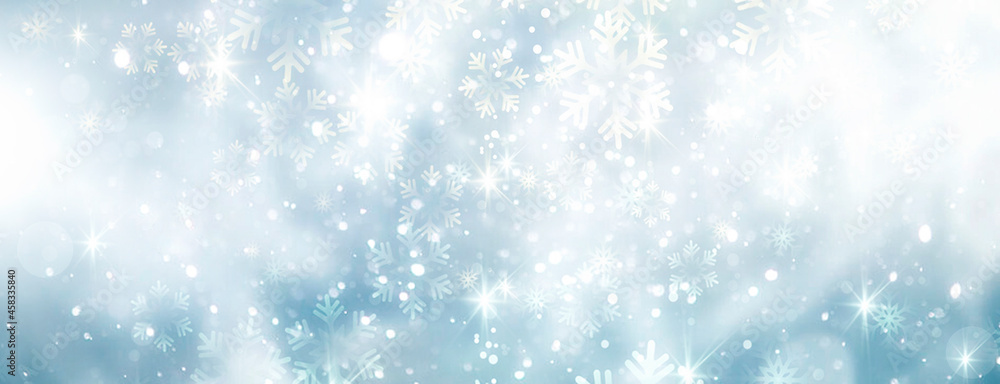Winter horizontal banner.Christmas backdrop. Blue snowflakes bokeh. Holiday seasonal background.