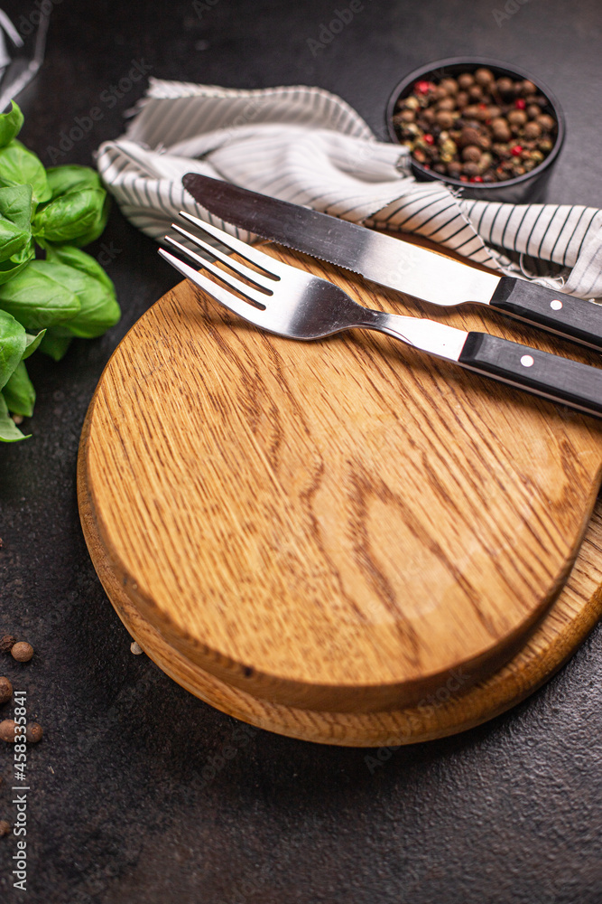 wooden serving board and cutlery fork and knife zero waste meal on the table copy space food background rustic. top view wooden serving board and cutlery fork and knife zero waste meal on the table copy space food background rustic. top view