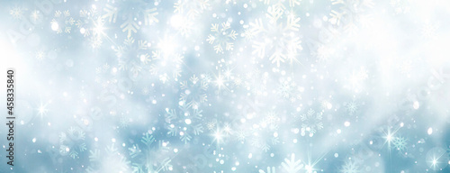 Winter horizontal banner.Christmas backdrop. Blue snowflakes bokeh. Holiday seasonal background.