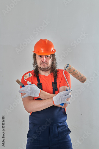 angry engineer with repair tools in an apartment