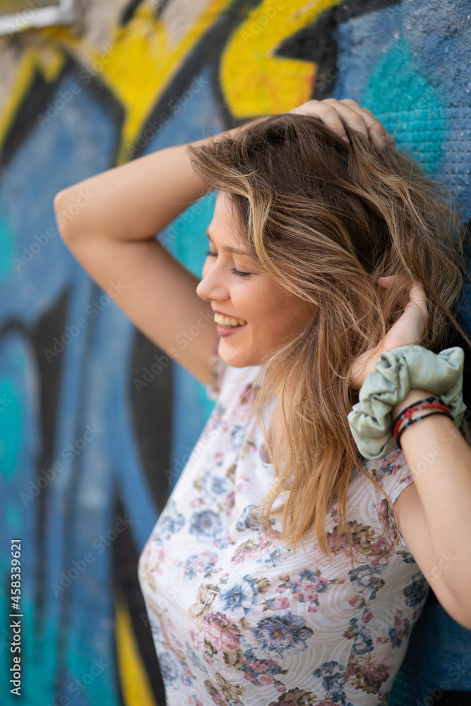 Naklejka premium Natural Looking Young Beautiful Woman with Hazel eyes posing in abandoned building, no post editing