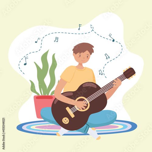 young man playing guitar
