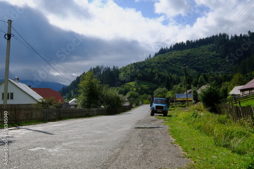 Ukrainian village, old car by the road. Ukraine is the village of Mizhirja.