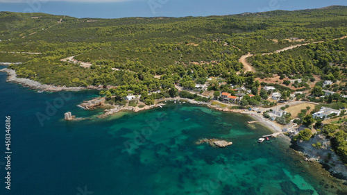 Aerial drone photo of famous bay and small traditional village of Atsitsa covered in pine trees and natural sandy beaches, Skiros island, Sporades, Greece © aerial-drone