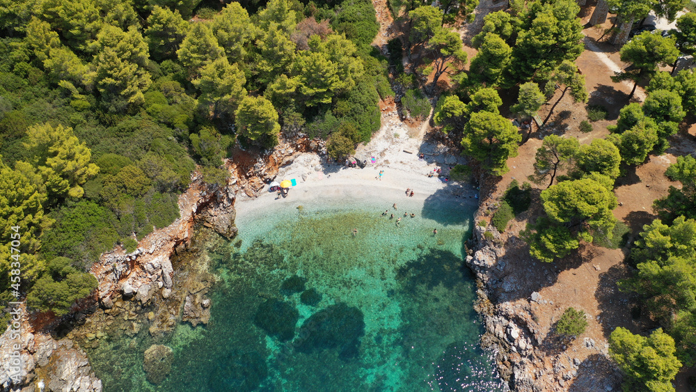 Aerial drone photo of famous bay and small traditional village of Atsitsa covered in pine trees and natural sandy beaches, Skiros island, Sporades, Greece Aerial drone photo of famous bay and small traditional village of Atsitsa covered in pine trees and natural sandy beaches, Skiros island, Sporades, Greece