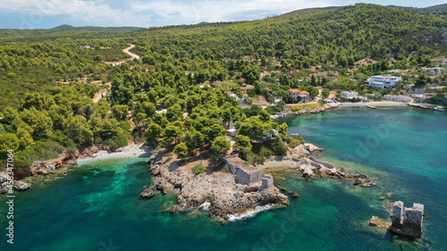 Aerial drone photo of famous bay and small traditional village of Atsitsa covered in pine trees and natural sandy beaches  Skiros island  Sporades  Greece