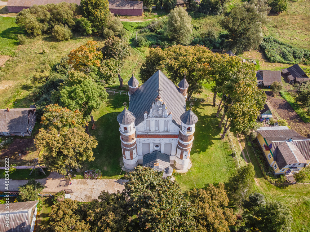 Top view of the old Church of the Nativity of the Blessed Virgin Mary in the village of Murovanka in Belarus. Drone aerial photo