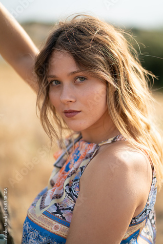 Natural Looking Young Beautiful Woman with Hazel eyes posing in the fields, no post editing