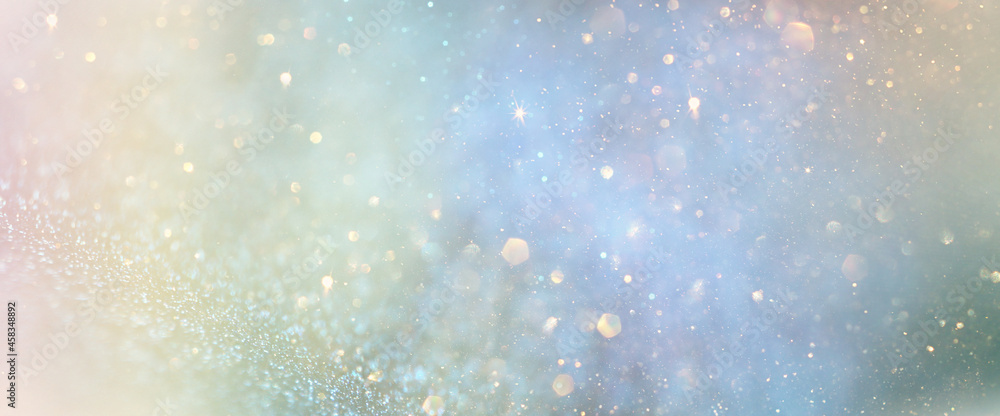 background of abstract glitter lights. gold, blue and green. de focused background of abstract glitter lights. gold, blue and green. de focused