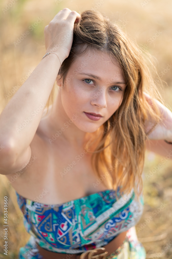 Natural Looking Young Beautiful Woman with Hazel eyes posing in the fields, no post editing Natural Looking Young Beautiful Woman with Hazel eyes posing in the fields, no post editing