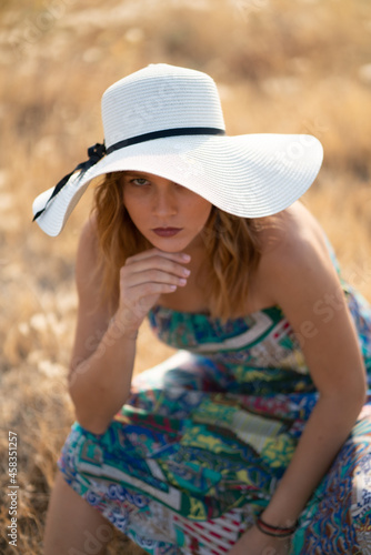 Natural Looking Young Beautiful Woman with Hazel eyes posing in the fields, no post editing