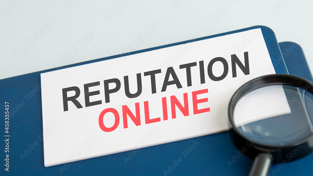 online reputation word on paper and magnifying lens online reputation word on paper and magnifying lens