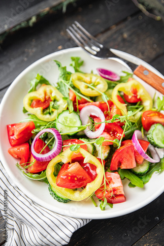 salad vegetables tomato, cucumber, pepper, onion, olive oil healthy food fresh portion veggie ready to eat meal snack on the table copy space food background rustic keto or paleo diet vegan