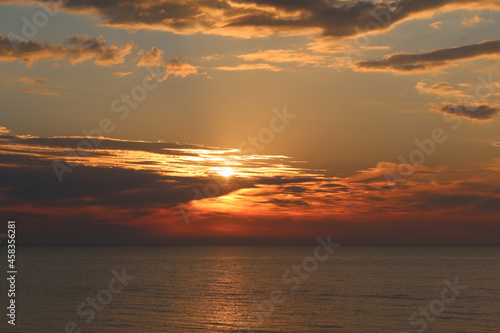 Scenic sunset over the sea. Calm Baltic sea. Poland seaside, Dabki village and beach. Seascape