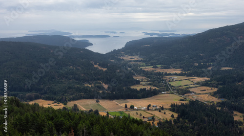 Aerial View of Salt Spring Island and farms from the top of Mt. Maxwell. Cloudy Summer Morning. Gulf Islands, British Columbia, Canada. Canadian Nature Background