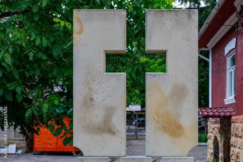 Two stones form a cross-shaped void. Religious Christian theme. Background with copy space for text photo