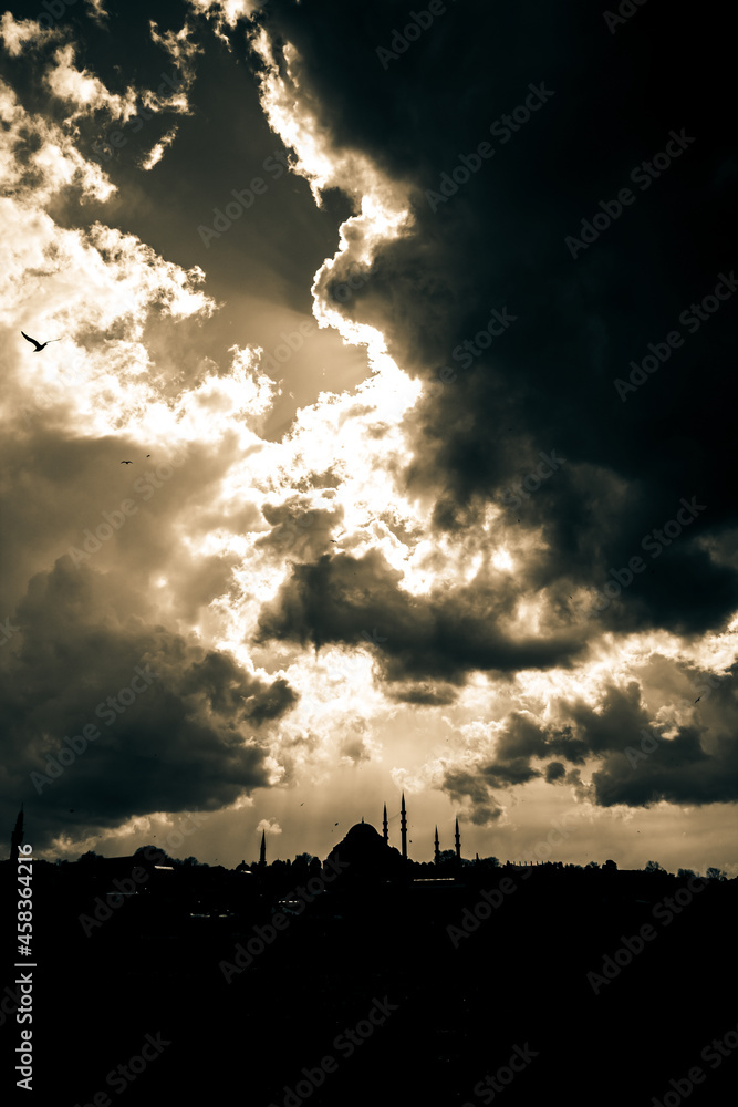 Silhouette of the mosque with cloudy sky. Dramatic clouds