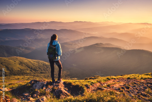 Girl with backpack on mount...