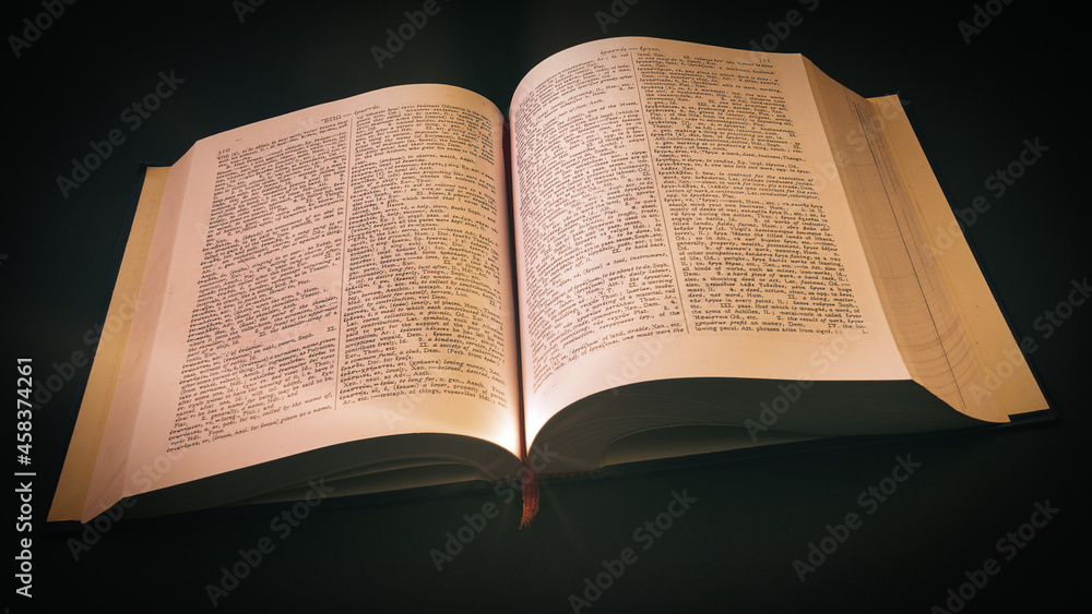 Obraz premium ancient Greek Dictionary with soft yellow dramatic light, Education, knowledge concept