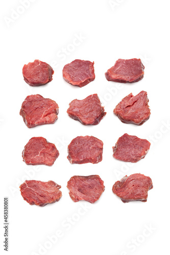 Juicy pieces of meat, top view. Rows raw Beef tenderloin (steaks) isolated on white background