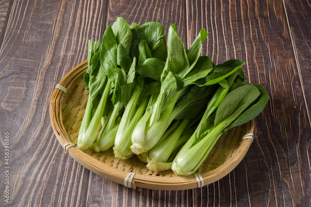 Pak Choi (Bok Choy) or Brassica chinensis green vegetable on wooden background Pak Choi (Bok Choy) or Brassica chinensis green vegetable on wooden background
